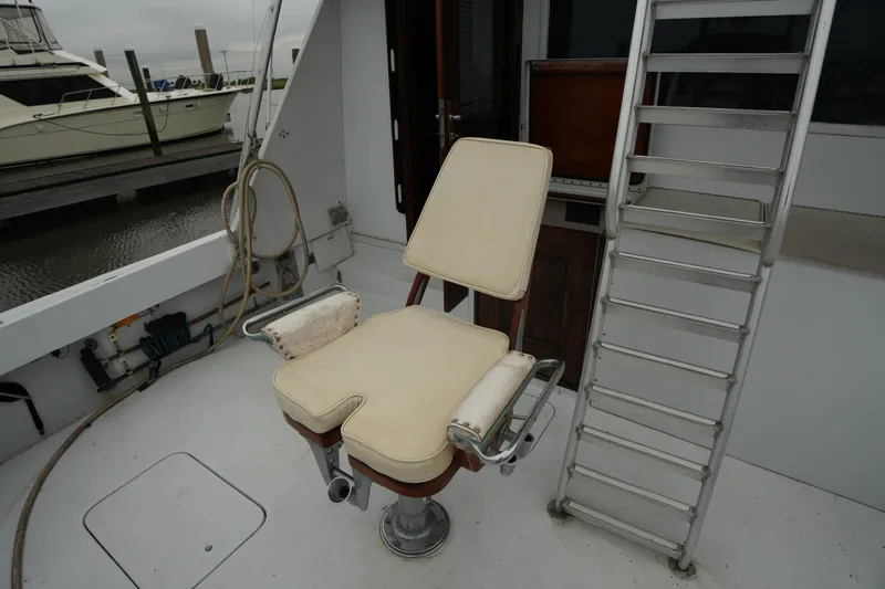 Slide: The Image of Fishing chair and ladder on 1980 Hatteras 50 Convertible yacht deck. - 13