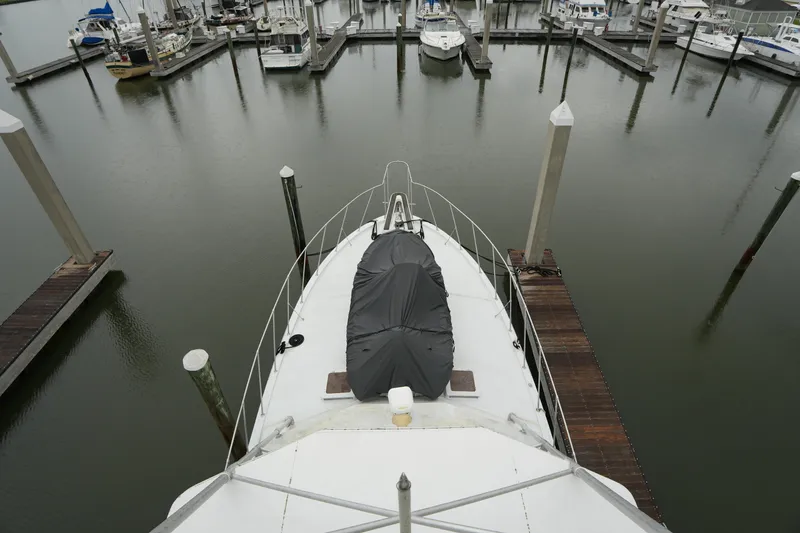 Slide: The Image of 1980 Hatteras 50 Convertible yacht docked in a marina, aerial view. - 29