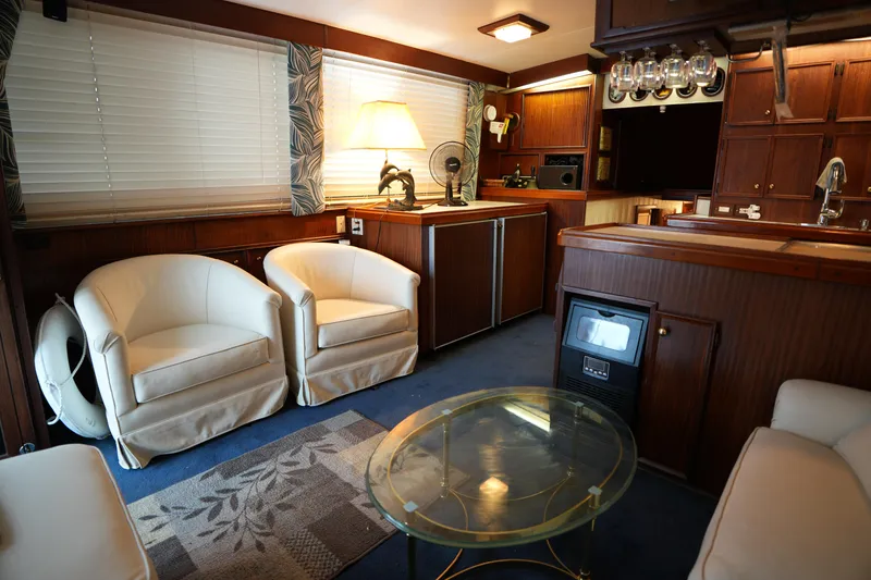 Slide: The Image of Interior of 1980 Hatteras 50 Convertible yacht, featuring cozy and elegant furnishings. - 34