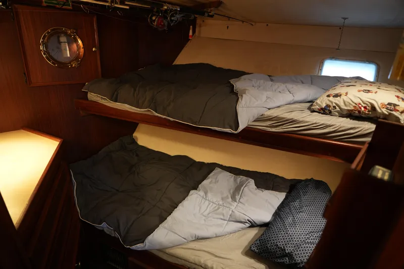 Slide: The Image of Cozy cabin with bunk beds on a 1980 Hatteras 50 Convertible yacht. - 43