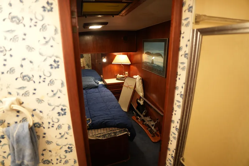 Slide: The Image of Cozy cabin interior of 1980 Hatteras 50 Convertible yacht with nautical decor. - 59