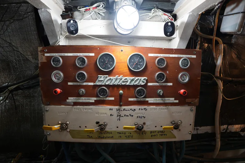 Slide: The Image of Control panel of a 1980 Hatteras 50 Convertible boat with gauges and wiring. - 66