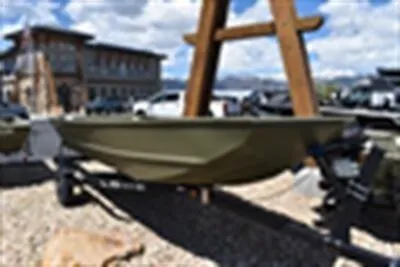 Slide: The Image of 2024 Lowe L1448M Jon boat displayed outdoors on a trailer. - 4