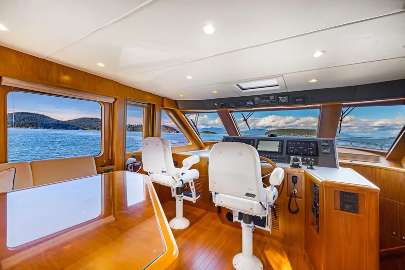 Slide: The Image of Luxurious 2023 Offshore Yachts 64 ELV helm with panoramic ocean views. - 11