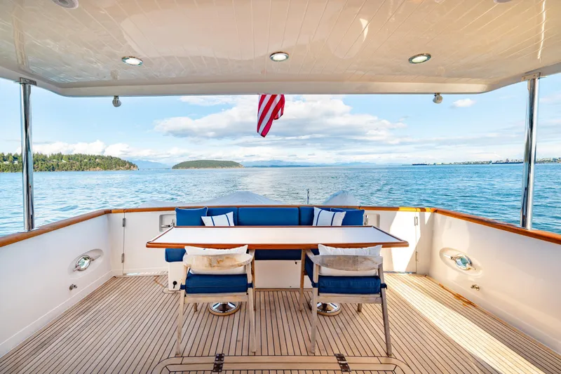 Slide: The Image of Luxurious 2023 Offshore Yachts 64 ELV deck with ocean view and elegant seating. - 27