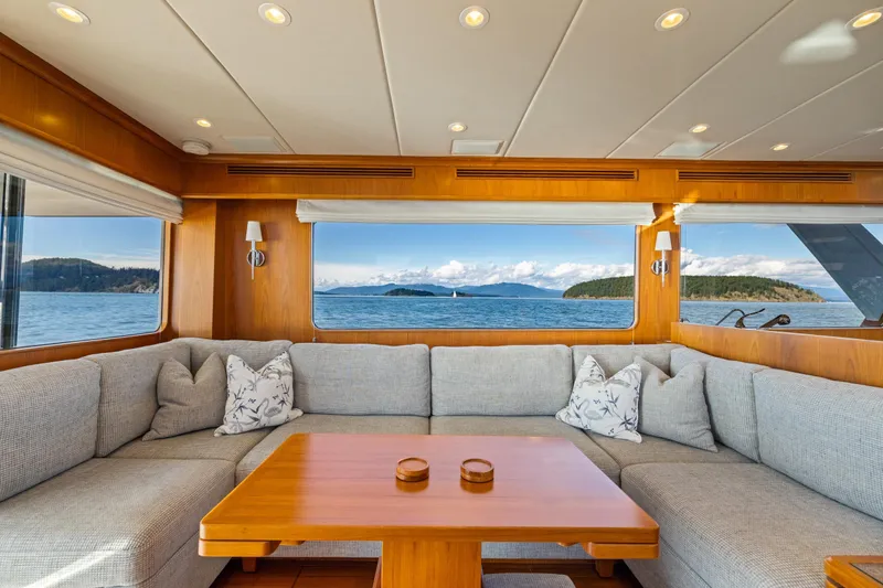 Slide: The Image of Luxurious interior of 2023 Offshore Yachts 64 ELV with ocean view through large windows. - 4