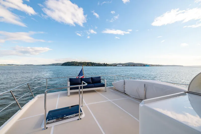 Slide: The Image of 2023 Offshore Yachts 64 ELV deck with ocean view and seating area. - 40
