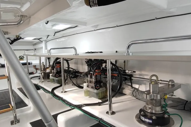 Slide: The Image of Engine room of 2023 Offshore Yachts 64 ELV, showcasing mechanical components and equipment. - 49