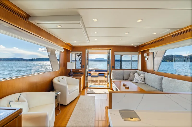 Slide: The Image of Luxurious interior of 2023 Offshore Yachts 64 ELV with panoramic ocean views. - 5