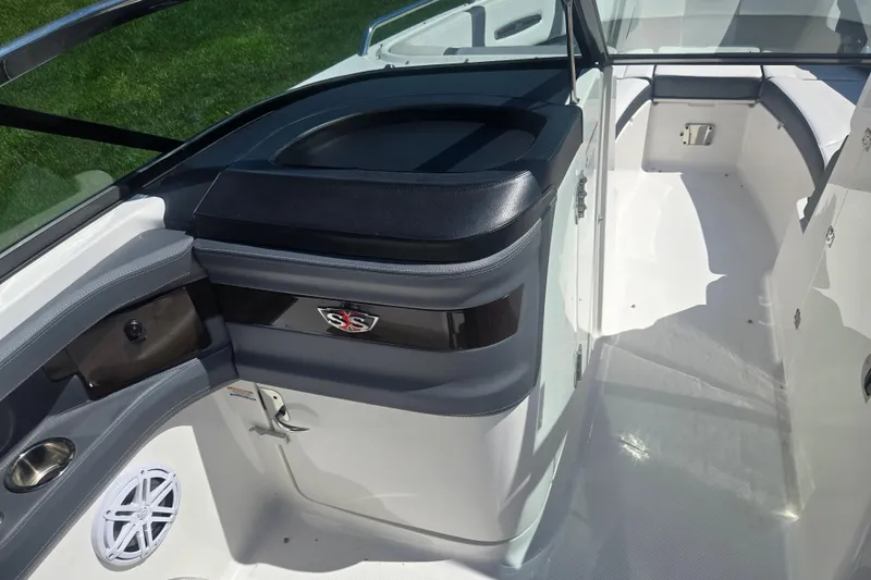 Slide: The Image of 2018 Chaparral 267 SSX boat interior with seating and storage compartments. - 14