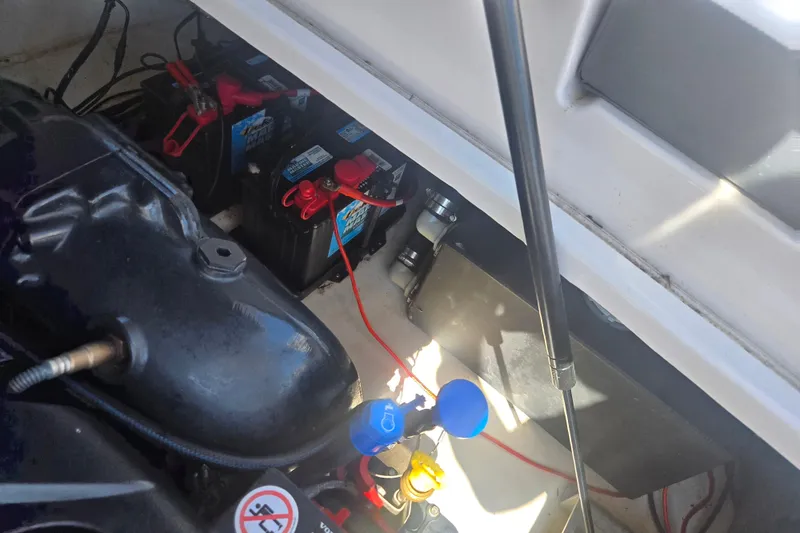 Slide: The Image of Engine compartment of 2018 Chaparral 267 SSX boat showing batteries and wiring. - 25
