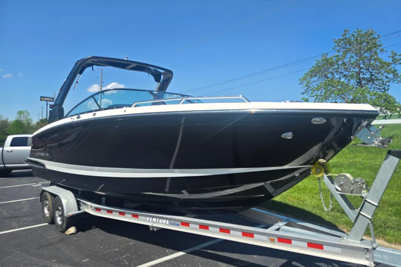 Slide: The Image of 2018 Chaparral 267 SSX boat on trailer under clear blue sky. - 5