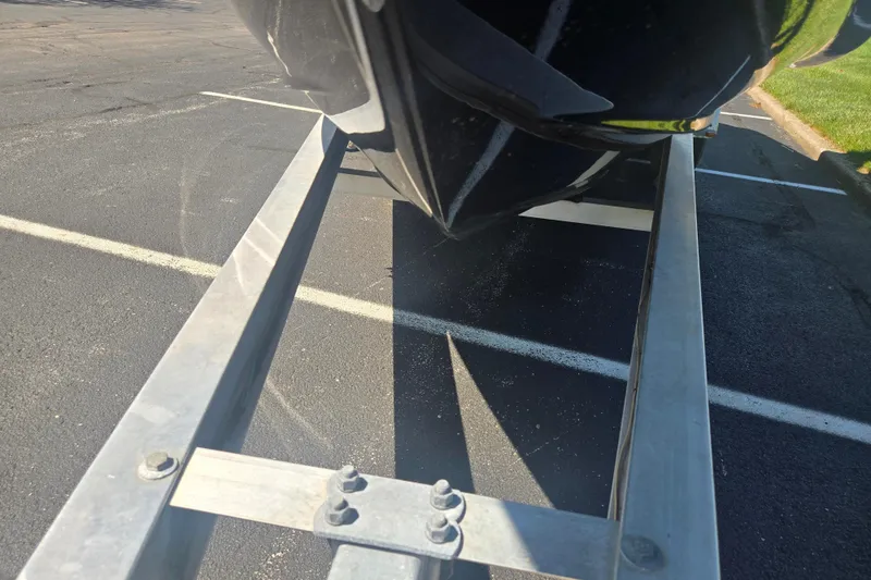 Slide: The Image of 2018 Chaparral 267 SSX boat on trailer, parked on asphalt. - 7