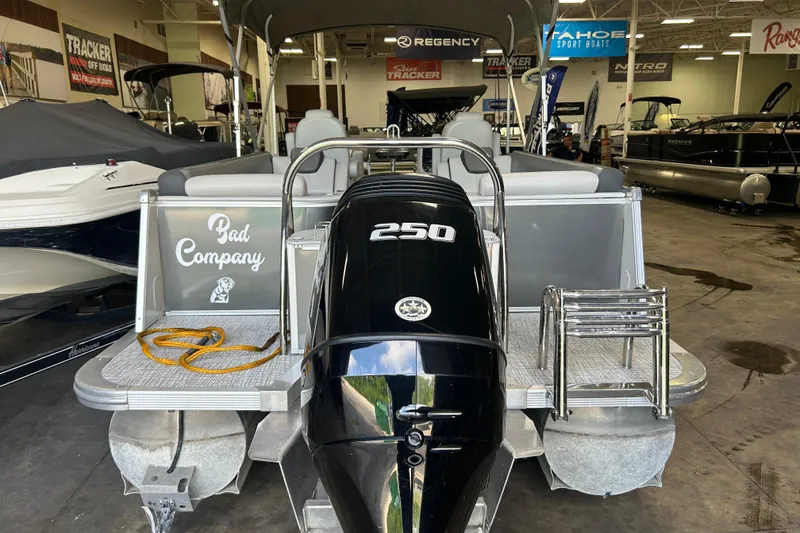 Slide: The Image of 2022 Tahoe Pontoon Cascade Quad Lounger with 250 HP engine in showroom. - 17