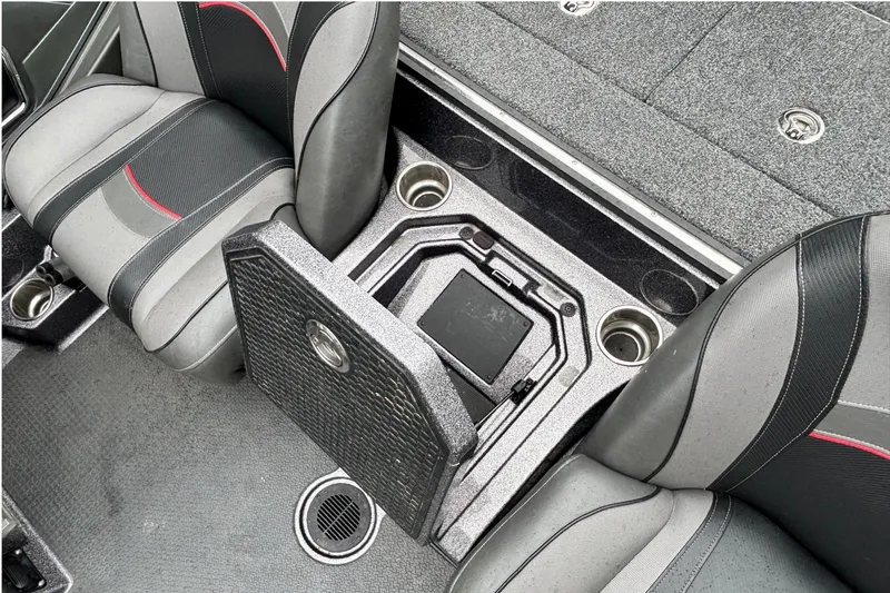 Slide: The Image of 2019 Ranger Z521L boat interior with storage compartment and cup holders. - 12