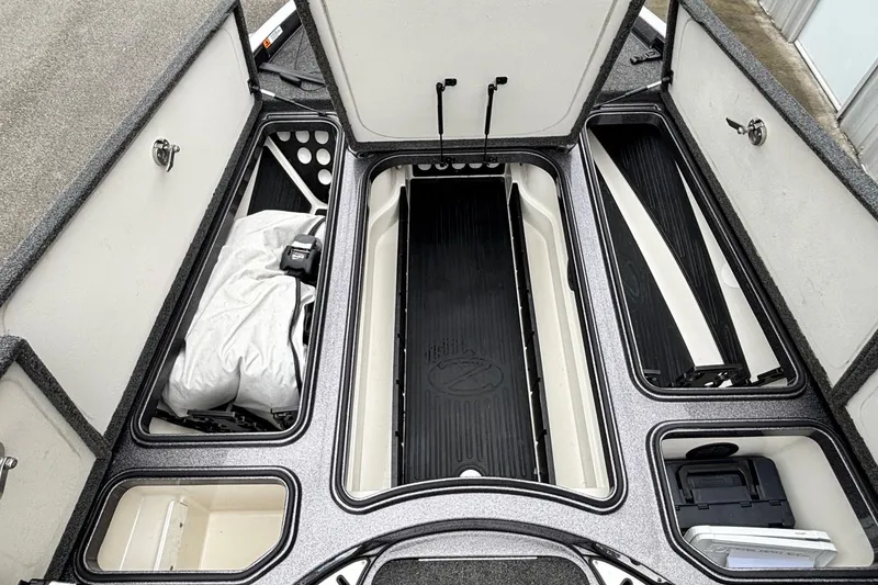 Slide: The Image of 2019 Ranger Z521L boat storage compartments with organized gear and equipment. - 7