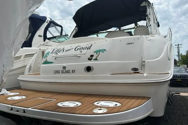 Slide: The Image of 2001 Sea Ray 38 Sundancer docked in Long Island, NY, with "Life's Good" text. - 1