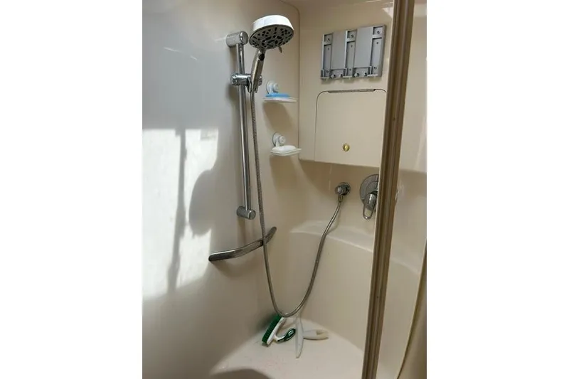 Slide: The Image of Shower area in a 2001 Sea Ray 38 Sundancer yacht, featuring modern fixtures. - 13