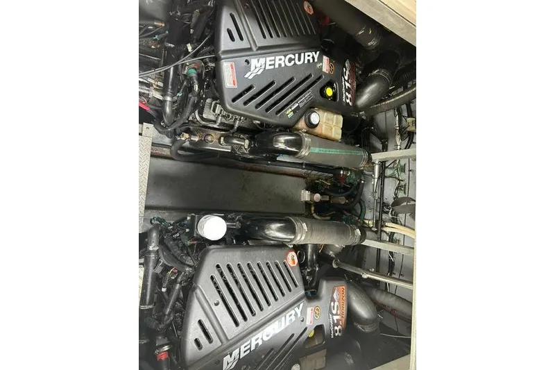 Slide: The Image of Twin Mercury engines in a 2001 Sea Ray 38 Sundancer boat engine room. - 14