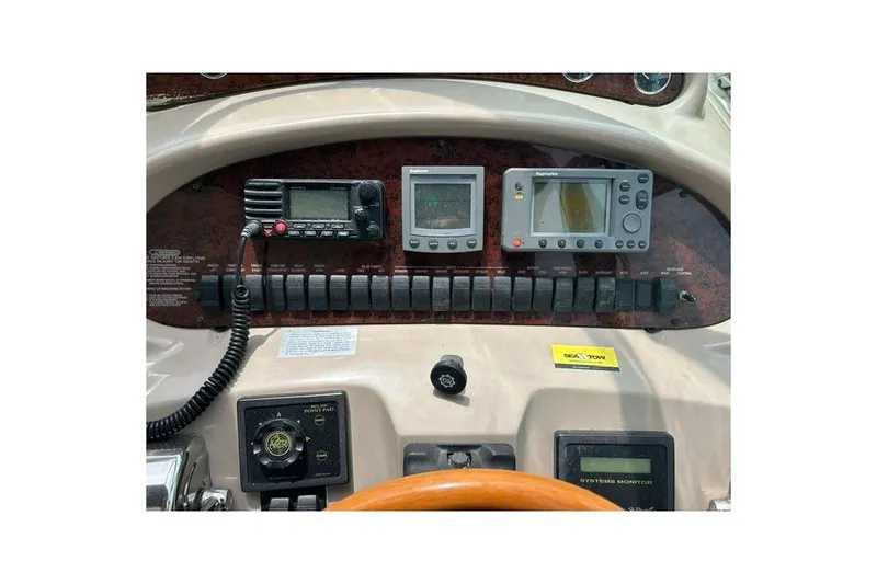 Slide: The Image of Control panel of a 2001 Sea Ray 38 Sundancer boat with navigation instruments. - 5