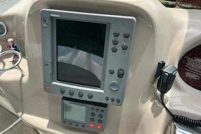 Slide: The Image of Control panel of a 2001 Sea Ray 38 Sundancer boat with navigation equipment. - 8
