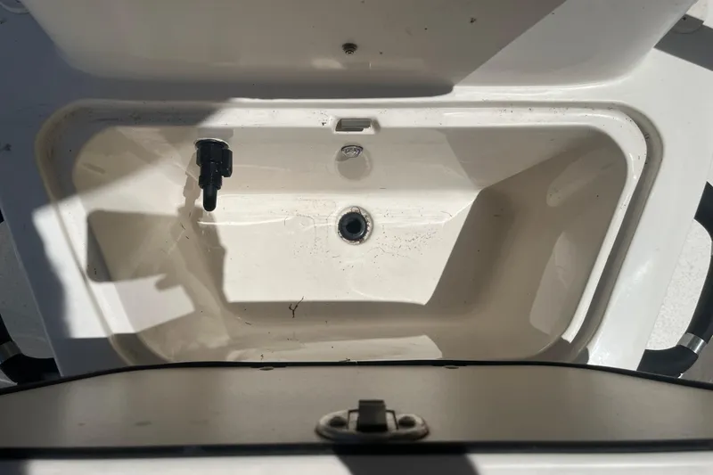 Slide: The Image of Open storage compartment in 2021 Sea Chaser 21 LX boat, showing interior details. - 10