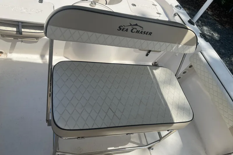 Slide: The Image of 2021 Sea Chaser 21 LX boat seat with diamond-patterned upholstery. - 12