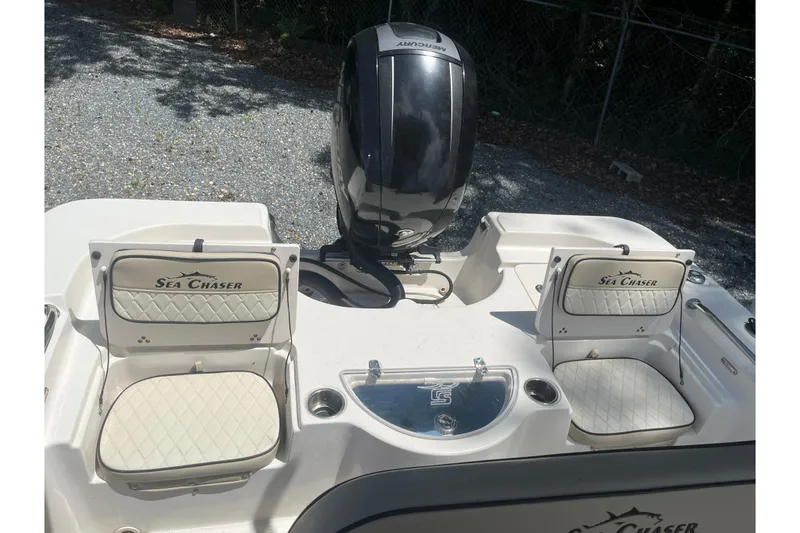 Slide: The Image of 2021 Sea Chaser 21 LX boat with dual seats and Mercury outboard motor. - 14