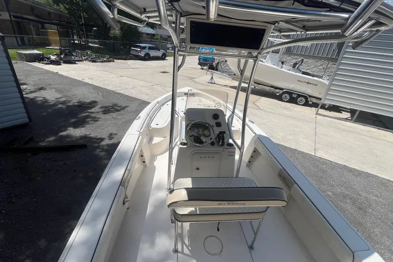 Slide: The Image of 2021 Sea Chaser 21 LX boat interior with steering console and seating. - 16