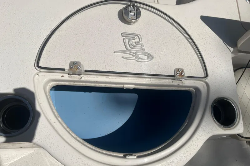 Slide: The Image of Open storage compartment on a 2021 Sea Chaser 21 LX boat deck. - 17