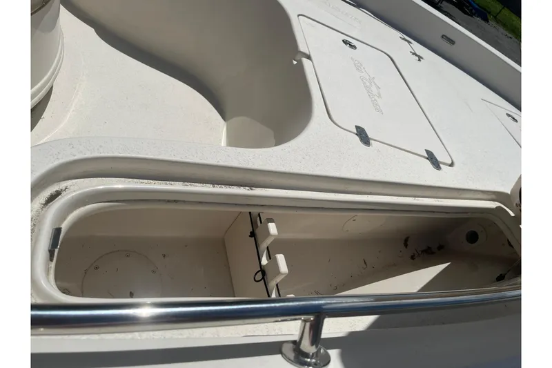 Slide: The Image of 2021 Sea Chaser 21 LX boat interior storage compartment with hatch and railing. - 19
