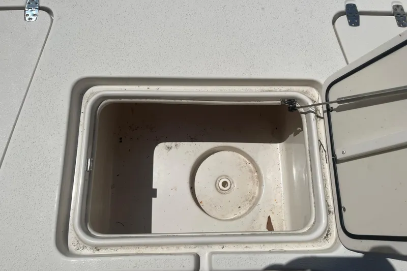 Slide: The Image of Open storage compartment on a 2021 Sea Chaser 21 LX boat, showing interior details. - 20