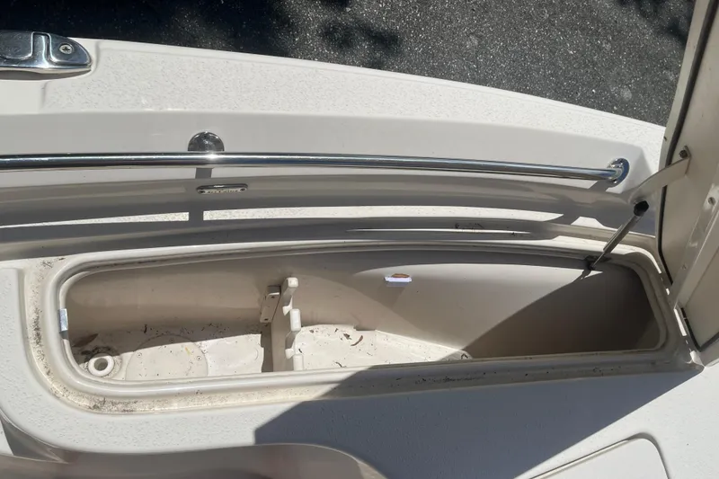 Slide: The Image of Open storage compartment on a 2021 Sea Chaser 21 LX boat, showing interior details. - 21