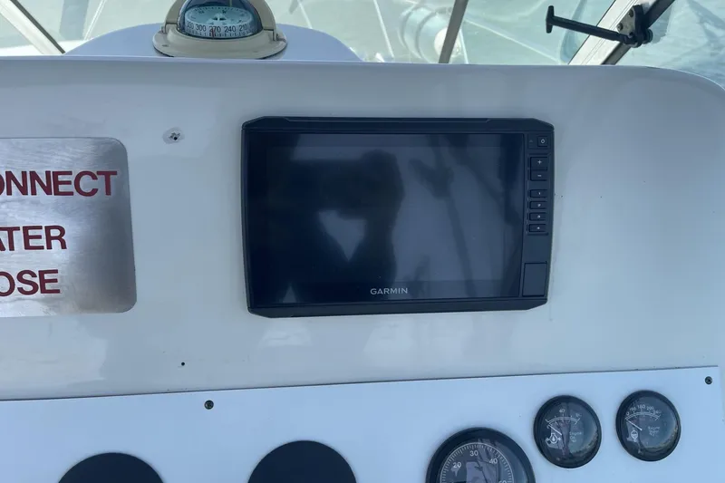 Slide: The Image of Dashboard of a 1997 Stamas 310 Express with Garmin display and compass. - 19