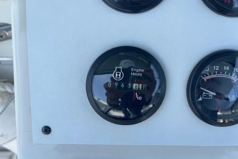 Slide: The Image of 1997 Stamas 310 Express engine hour meter displaying 963.8 hours. - 20