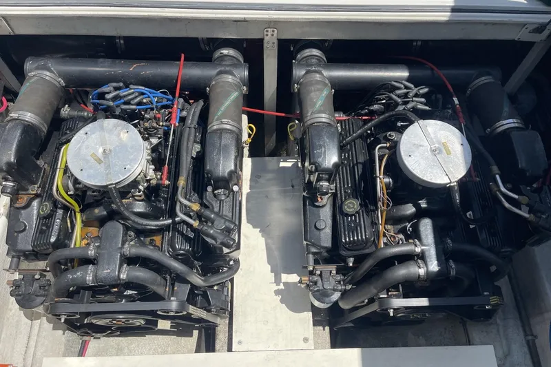 Slide: The Image of Twin engines of a 1997 Stamas 310 Express boat, showcasing detailed mechanical components. - 39
