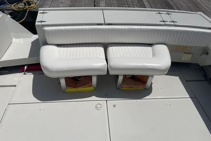 Slide: The Image of 1997 Stamas 310 Express boat with white cushioned seating on deck. - 8