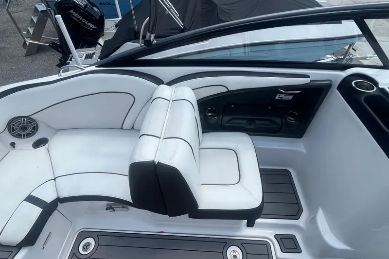 Slide: The Image of 2014 Yamaha Boats AR240 HO interior with white seating and speaker system. - 13