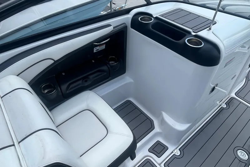 Slide: The Image of 2014 Yamaha Boats AR240 HO interior seating with cup holders and sleek design. - 16