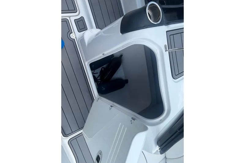 Slide: The Image of Open storage compartment on 2014 Yamaha Boats AR240 HO, showcasing interior space. - 20