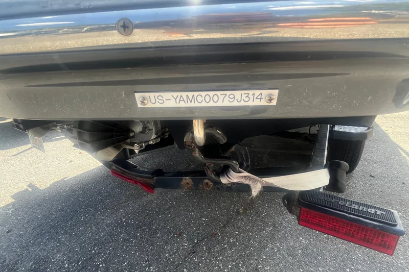 Slide: The Image of 2014 Yamaha Boats AR240 HO trailer hitch and license plate detail. - 24