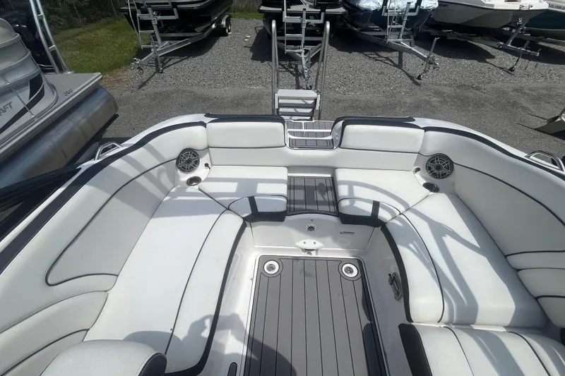 Slide: The Image of Interior of a 2014 Yamaha AR240 HO boat with white seating. - 9