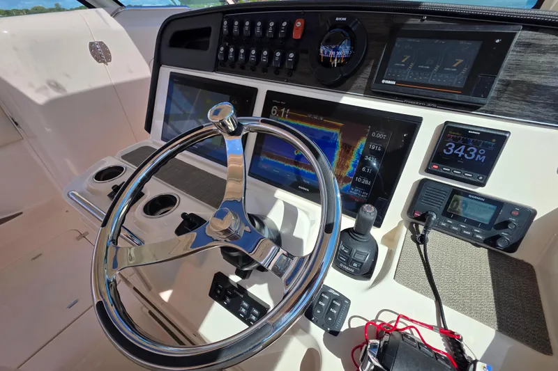 Slide: The Image of Control panel of 2019 Grady-White Freedom 375 boat with advanced navigation systems. - 18