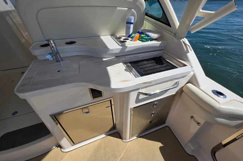 Slide: The Image of Grady-White Freedom 375 boat kitchen area with sink and grill, 2019 model. - 20