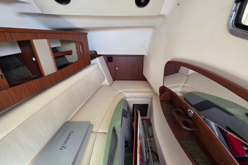 Slide: The Image of 2019 Grady-White Freedom 375 cabin interior with seating and storage. - 23