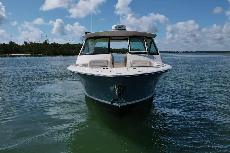 Slide: The Image of 2019 Grady-White Freedom 375 boat on calm water under a blue sky. - 6