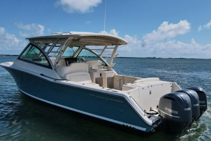 Slide: The Image of 2019 Grady-White Freedom 375 boat with twin Yamaha engines on calm water. - 4