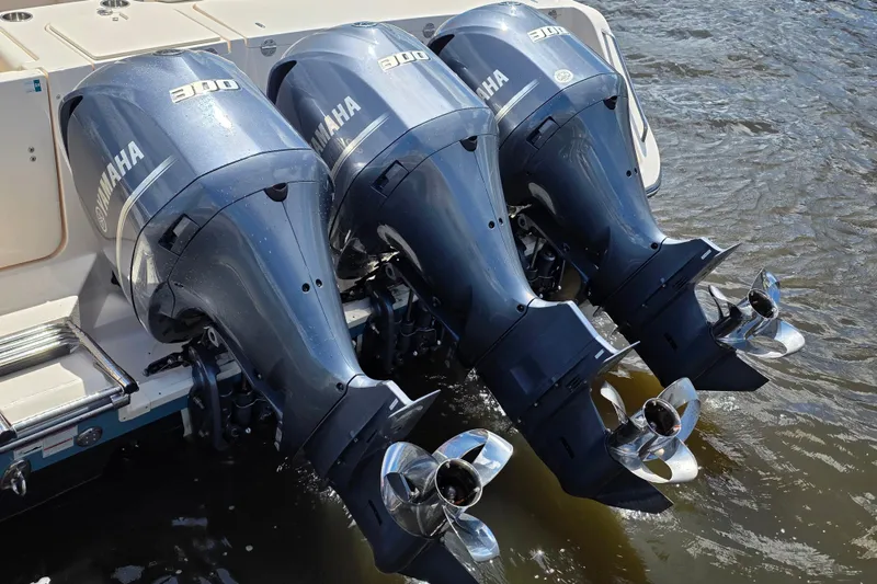 Slide: The Image of Triple Yamaha 300 outboard engines on a 2019 Grady-White Freedom 375 boat. - 8