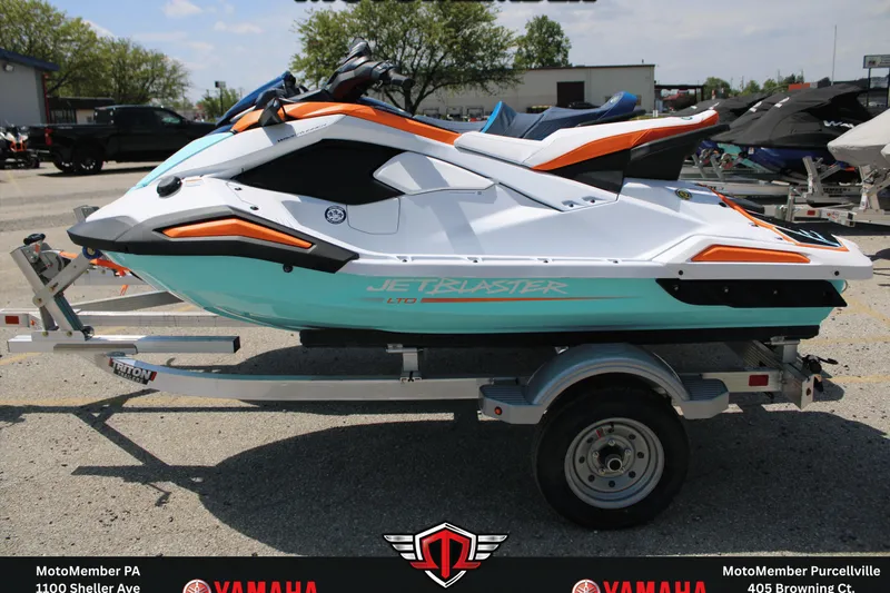 The Image of 2026 Yamaha WaveRunner JetBlaster LTD on trailer, vibrant design, outdoor setting. - 0