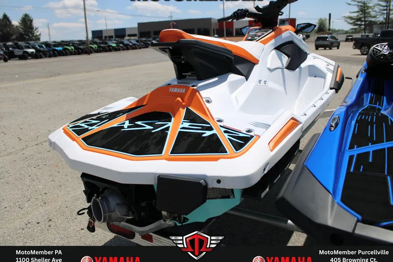 Slide: The Image of 2026 Yamaha WaveRunner JetBlaster LTD in orange and white, displayed outdoors at a dealership. - 5